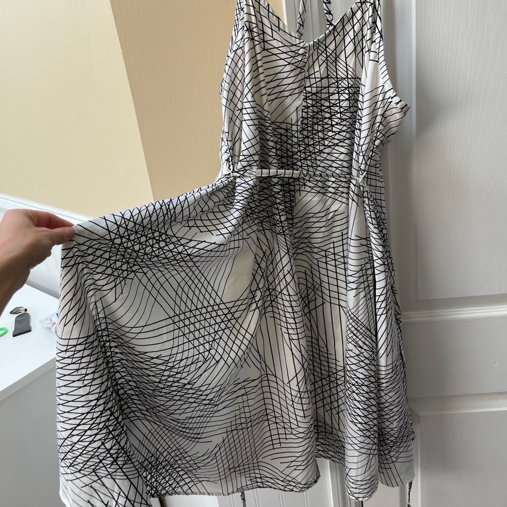 Flowing black and white t-strap maternity dress